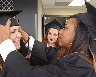 William D. Lewis The Vindicator YSU Bachelor of Social Work grads from left, Emily McAllen of Youngstown, Tina Hamett of New Castle and Kierra Arnold of Pittsburgh before the Dec 18, 2016 commencement ceremony at YSU.