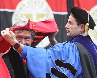 William D. Lewis The Vindicator  Speaker Sam Covelli, left, is awarded honoray degree during 12182016 YSU commencement ceremony. Helping with the hooding is YSU Provost Dr. Martin Abraham.