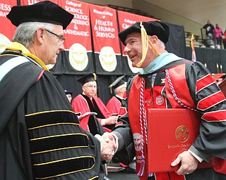 William D. Lewis The Vindicator  Daniel Frederick Cesene gets congrats from YSU Pres. Jim Tressel after being presented a Doctor of Education degree during 12182016 YSU commencement ceremony.