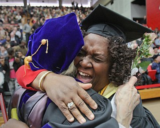 William D. Lewis The Vindicator  Delores Tresa Womack, right, gets a hug from YSU faculty member Dr. Thelma Silver after recieving a Bachelor of Social work degree during 12182016 YSU commencement ceremony.