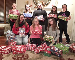 SPECIAL TO THE VINDICATOR
Boardman Poland Juniorettes recently packed and wrapped shoeboxes for Operation Christmas Child with toys, hygiene items and school supplies collected from family members and Boardman Poland Junior Women’s League members. The Juniorettes prepared 28 shoeboxes and will track the boxes online to see where they are sent to children around the world. Juniorettes is a service group for girls age 12 to 18 and is sponsored by the Junior Women’s League. Current members attend Struthers, Cardinal Mooney, Canfield, St. Nicholas and Ursuline schools. Upcoming projects include decorating a wildlife edible Christmas tree at Boardman Park, a Christmas party and delivering Christmas cards at Glenellen Assisted Living. Juniorettes, in front from left, are Natalie Meadors, Bridget Bobovnyik and Jessica Felleti. In back are Gia Radilovic, Isabella Glover, Gianna Glover, Abby Vernon and Sabrina Goodrich. For information about membership, call Debbie Weaver at 330-720-6510.