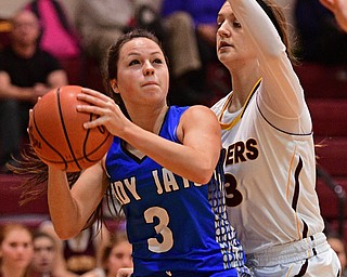 CANFIELD, OHIO - DECEMBER 19, 2016: Emily Williams #3 of Jackson Milton looks to the basket while being pressured by Kate Yeagley #3 of South Range during the first half of their game Monday night at South Range High School. DAVID DERMER | THE VINDICATOR