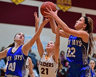 CANFIELD, OHIO - DECEMBER 19, 2016: Michaelina Terranova #22 of Jackson Milton grabs a rebound away from teammate Abigail Spalding #40 and Sam Patrone #21 of South Range during the first half of their game Monday night at South Range High School. DAVID DERMER | THE VINDICATOR