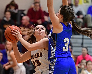 CANFIELD, OHIO - DECEMBER 19, 2016: Taylor Naples #23 of South Range looks to the basket while being pressured by Emily Williams #3 of Jackson Milton during the second half of their game Monday night at South Range High School. DAVID DERMER | THE VINDICATOR
