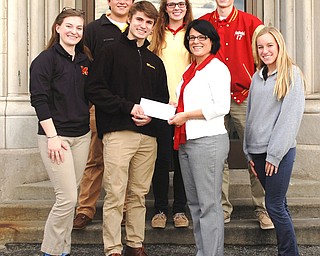 SPECIAL TO THE VINDICATOR
Cardinal Mooney High School celebrated Giving Tuesday by donating $500 to Rescue Mission of the Mahoning Valley with the help of an anonymous alumna donor. Because eighth grade students are too young to volunteer for the Rescue Mission, Mooney made the donation in honor of all Lumen Christi eighth grade students in the Diocese of Youngstown, St. Paul School, Salem, and St. Joseph the Provider School, Youngstown. Mooney Hospitality Team members toured the mission’s facility Nov. 29 and presented the check to Crystal Eckman, mission ambassador. In front from left, are Kate Pelini, Nico Marchionda, Eckman and Mackenzie Hammond. In back are Nick Blasko, Taylor Martin and Pat Pelini. 