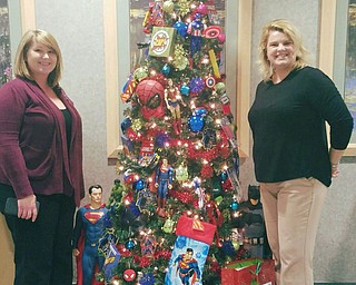 SPECIAL TO THE VINDICATOR
Park Center Healthcare and Rehabilitation Center, Youngstown, and Ivy Woods Healthcare and Rehabilitation Center, Boardman, recently participated in Mercy Health System Hospitals’ annual Christmas fundraiser, “Christmas Tree Lane.” The hospital system and their partners raffle Christmas trees which they have decorated. Proceeds go to needy hospital patients and fund basic necessities such as clothing. Park Center decorated two trees and Ivy Center decorated a superhero tree. Monica Cosma, Ivy Woods network director, left, and Ragan Starcher, admissions coordinator, stand with the superhero tree.