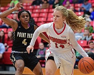 YOUNGSTOWN, OHIO - DECEMBER 21, 2016: Melinda Trimmer #14 of YSU drives on Shaniya Rivers #4 of Point Park during the first half of their game Tuesday morning at Beeghly Center. YSU won 84-71. DAVID DERMER | THE VINDICATOR