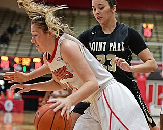 YOUNGSTOWN, OHIO - DECEMBER 21, 2016: Morgan Brunner #34 of YSU dribbles away from Tyra James #23 of Point Park after grabbing a rebound during the first half of their game Tuesday morning at Beeghly Center. YSU won 84-71. DAVID DERMER | THE VINDICATOR