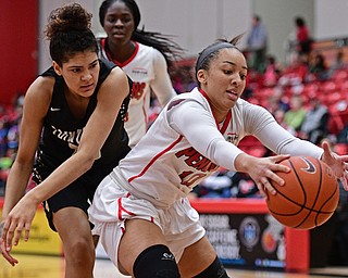 YOUNGSTOWN, OHIO - DECEMBER 21, 2016: Mailee Jones #10 of YSU grabs a rebound away from Baylee Buleca #55 of Point Park during the first half of their game Tuesday morning at Beeghly Center. YSU won 84-71. DAVID DERMER | THE VINDICATOR