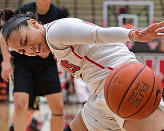 YOUNGSTOWN, OHIO - DECEMBER 21, 2016: Mailee Jones #10 of YSU reaches in an attempt to grab a loose ball during the first half of their game Tuesday morning at Beeghly Center. YSU won 84-71. DAVID DERMER | THE VINDICATOR