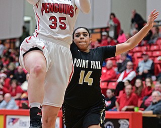YOUNGSTOWN, OHIO - DECEMBER 21, 2016: Kelley Wright goes tot he basket after getting behind Maryssa Agurs #14 of Point Park during the first half of their game Tuesday morning at Beeghly Center. YSU won 84-71. DAVID DERMER | THE VINDICATOR