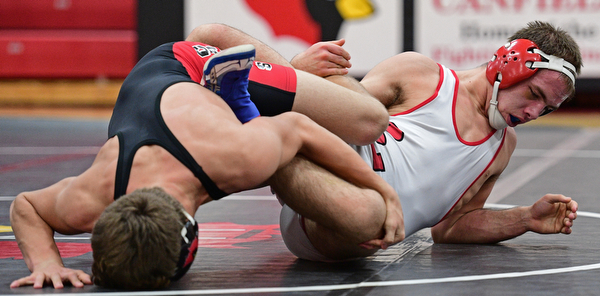 CANFIELD, OHIO - DECEMBER 21, 2016: Beau Smith of Beaver Local and Anthony D'Alesio of Canfield wrestler on the mat during their 152lb bout Wednesday night at Canfield High School. DAVID DERMER | THE VINDICATOR