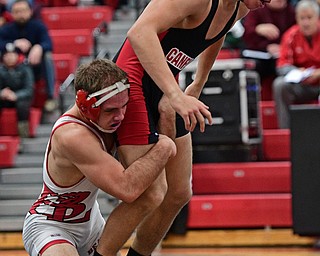 CANFIELD, OHIO - DECEMBER 21, 2016: Anthony D'Alesio of Canfield attempts to break free from the grasp of Beau Smith of Beaver Local and prevent being taken down during their 152lb bout Wednesday night at Canfield High School. DAVID DERMER | THE VINDICATOR
