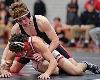 CANFIELD, OHIO - DECEMBER 21, 2016: Braxton Madison of Canfield controls the back of Steve Wukotich of Beaver Local during their 170lb bout Wednesday night at Canfield High School. DAVID DERMER | THE VINDICATOR