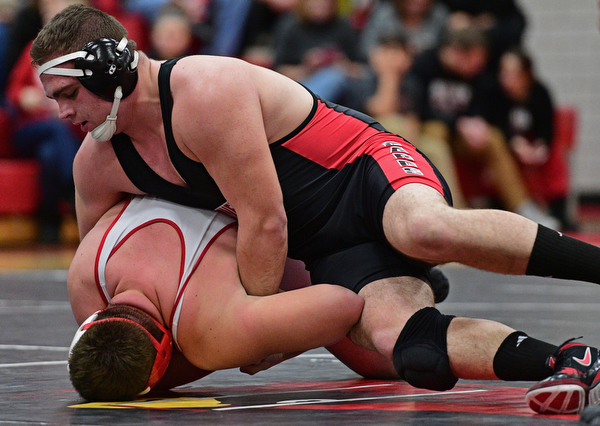 CANFIELD, OHIO - DECEMBER 21, 2016: Mason Giordano of Canfield controls the back of Zach Thomas of Beaver Local during their 285lb bout Wednesday night at Canfield High School. DAVID DERMER | THE VINDICATOR
