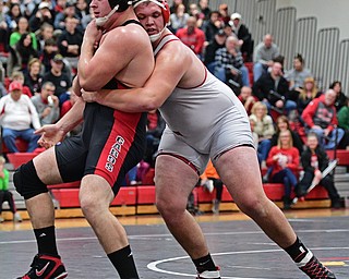 CANFIELD, OHIO - DECEMBER 21, 2016: Mason Giordano of Canfield breaks free from the grasp of Zach Thomas of Beaver Local during their 285lb bout Wednesday night at Canfield High School. DAVID DERMER | THE VINDICATOR