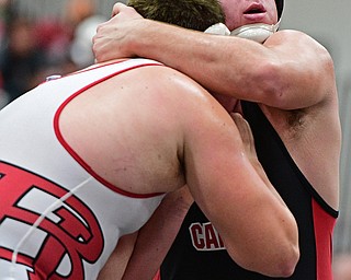 CANFIELD, OHIO - DECEMBER 21, 2016: Mason Giordano of Canfield grapples with Zach Thomas of Beaver Local during their 285lb bout Wednesday night at Canfield High School. DAVID DERMER | THE VINDICATOR