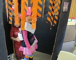 Neighbors | Alexis Bartolomucci.One student wrapped up another as a mummy during the Fall Harvest Party on Oct. 27 at Hitchcock Woods Learning Center.