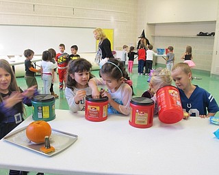 Neighbors | Alexis Bartolomucci.Students in Samantha Cox and Joy Bucci's classes participated in different Halloween science experiments at North Preschool on Oct. 31.