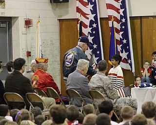 Neighbors | Abby Slanker.A C.H. Campbell Elementary School second-grader presented a veteran with a flag during the school’s annual Veterans Day Assembly on Nov. 11.