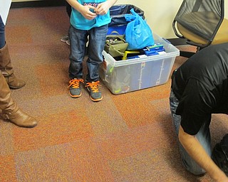 Neighbors | Alexis Bartolomucci.An Austintown Elementary School student tried out his new shoes he received from Soles of Luv on Nov. 13.