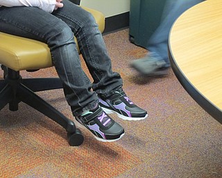 Neighbors | Alexis Bartolomucci.An Austintown Elementary School student tried on a new pair of shoes she received from Soles of Luv on Nov. 16.