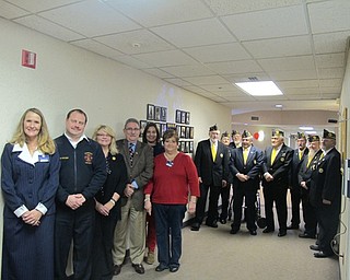 Neighbors | Alexis Bartolomucci.The Wall of Valor dedication ceremony brought in several Boardman Township administrators. Pictured are, from left, (front) Beeghly recreation director Maureen McCarty, Fire Chief Mark Pitzer, Deputy Administrator Stephanie Landers, Trustee Tom Costello, Beeghly concierge director Carol Zeigler and Beeghly administrator Alison Alvino; (back) members of the American Legion Post 247 of Lowellville.