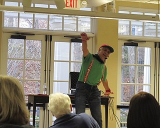 Neighbors | Alexis Bartolomucci.Don Monopoli, member of The Learning Station, performed several holiday songs for families during the Children's Holiday Journey event at the Poland library on Nov. 26.