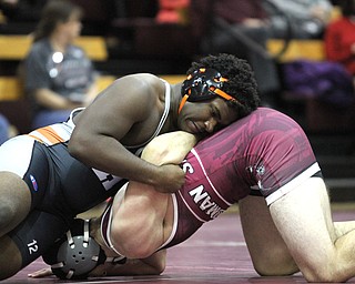 Isom Julian(black) locks Alex King(red) on the ground in the Boardman High School Gymnasium on Thursday, Dec. 22, 2016...(Nikos Frazier | The Vindicator)..