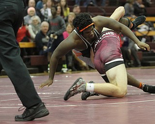 Isom Julian(black) flies to the ground as Alex King(red) counters in the Boardman High School Gymnasium on Thursday, Dec. 22, 2016...(Nikos Frazier | The Vindicator)..