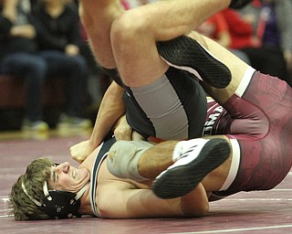 Nathan Scott(black) struggles with Michael O'Horo(red) in the Boardman High School Gymnasium on Thursday, Dec. 22, 2016...(Nikos Frazier | The Vindicator)..