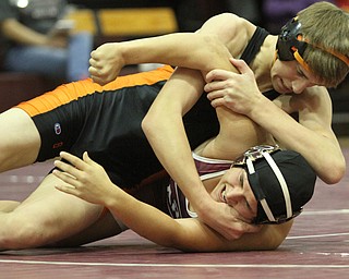 Ray Kaso(black) locks Kareem Hamden(red) on the ground in the Boardman High School Gymnasium on Thursday, Dec. 22, 2016...(Nikos Frazier | The Vindicator)..