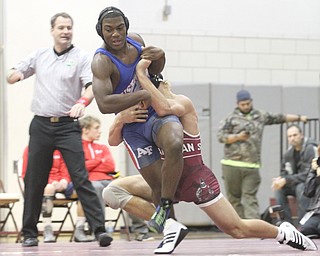 Boardman's Michael O'Horo(red) throws Fitch's Wille Beverly(blue) in the Boardman High School Gymnasium on Thursday, Dec. 22, 2016. 170 pounds..(Nikos Frazier | The Vindicator)..