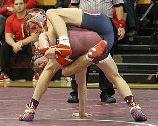 Fitch's Kyle Varga(top) tries to land on top of Boardman's Carlo DeNiro(red) in the Boardman High School Gymnasium on Thursday, Dec. 22, 2016. 182 pounds..(Nikos Frazier | The Vindicator)..