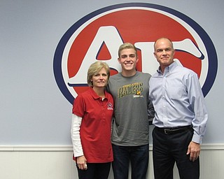 Neighbors | Submitted.Senior swimmer Tim Kubacki is pictured with his mother and coach, Tina Kubacki, and his father, Daniel Kubacki.