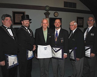 SPECIAL TO THE VINDICATOR
Argus Lodge 545 of Canfield honored David Lavrock on Oct. 28 as Mason of the Year. The award is given to a member who has diligently served the lodge. Lavrock has been a member of the lodge for 21 years and also is a member of the Fellowcraft Team and Tuesday Bunch. He lives in Boardman with his wife, Nancy. They have a daughter, Megan, and one grandchild. Lavrock graduated from Boardman High School and worked at Akron Energy until his retirement. He also serves as captain with the 19th Ohio Volunteer Infantry Civil War Re-enactment group, and enjoys restoring antique cars. Masons present for the award, from left, are Daniel Gibboney, Ryan Hamilton, Lavrock, Robert Ridzon, Harold Cook and James Cardelein.