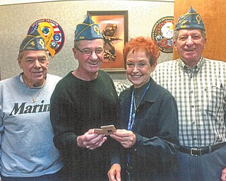 SPECIAL TO THE VINDICATOR
Catholic War Veterans Post 1292 of Youngstown recently sponsored an annual reverse raffle and basket auction for needy veterans and their families. Lori Stone, a volunteer at the Youngstown Veterans Clinic, accepted the $1,000 donation from Al Bisker, left, post trustee; Gary Barnes, post commander; and John Tromel, second vice commander.

