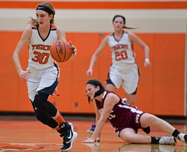 HOWLAND, OHIO - DECEMBER 23, 2016: Alex Ochman #30 of Howland dribbles up court after taking it away from Lauren Gabriele #20 of Boardman during the second half of their game Friday night at Howland High School. DAVID DERMER | THE VINDICATOR