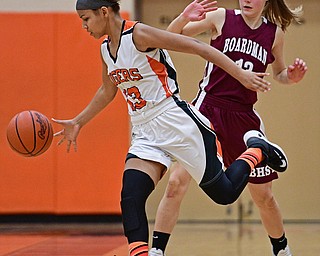 HOWLAND, OHIO - DECEMBER 23, 2016: Amber Rodriguez #13 of Howland gains possession of the ball after taking it away from Cate Green #13 of Boardman during the second half of their game Friday night at Howland High School. DAVID DERMER | THE VINDICATOR