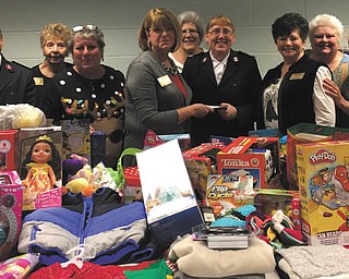 SPECIAL TO THE VINDICATOR
Warren Republican Women’s Club hosted its annual Christmas celebration on Dec. 1 at the Salvation Army Community Room in Warren. Salvation Army Majors Michael and Dianna Morales greeted the club members. The event featured a potluck lunch, games and door prizes. Club members donated money and more than 100 items of clothing and toys to the Salvation Army for its annual community Christmas distribution. Club members, from left, are Cathy Lukasko, treasurer; Major Michael Morales; Edwina Wolcott, membership; Gail Drushel, newsletter; Barbara Rosier-Tryon, president; Sandy Mahaffey, historian; Major Dianna Morales; Judie Shortreed, secretary; Cary Ann Sullivan, first vice president; Kathi Creed, political action; and Carol Griffiths, sunshine.