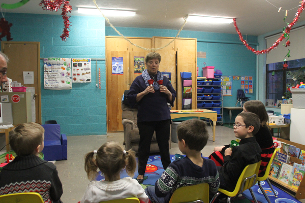Debbie Chick instructs the kids before they participate in Ring-A-Lings at Boardman United Methodist Church in Boardman on Saturday, Dec. 24, 2016...(Nikos Frazier | The Vindicator)..