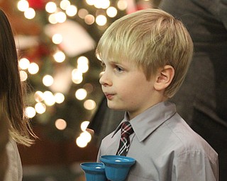 Carter Yocum(7) of Boardman as children participate in Ring-A-Lings at Boardman United Methodist Church in Boardman on Saturday, Dec. 24, 2016...(Nikos Frazier | The Vindicator)..