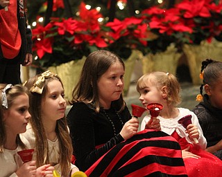 Skylar Ewing(12)(red) of Boardman as children participate in Ring-A-Lings at Boardman United Methodist Church in Boardman on Saturday, Dec. 24, 2016...(Nikos Frazier | The Vindicator)..