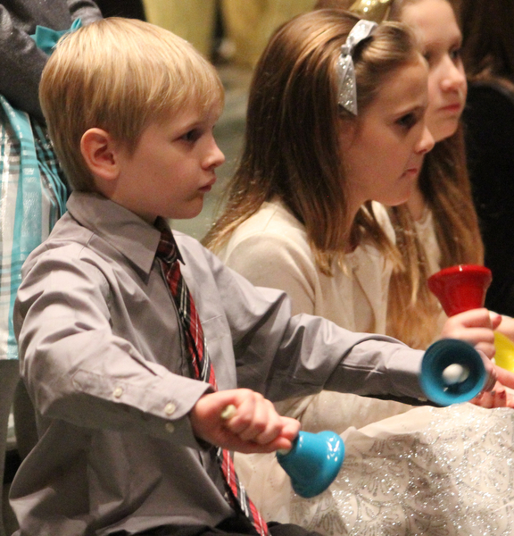 Carter Yocum(7) of Boardman as children participate in Ring-A-Lings at Boardman United Methodist Church in Boardman on Saturday, Dec. 24, 2016...(Nikos Frazier | The Vindicator)..