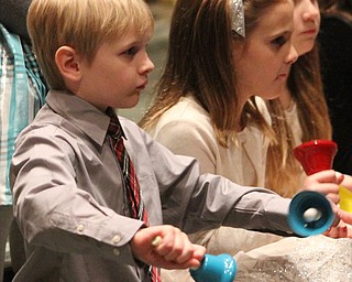 Carter Yocum(7) of Boardman as children participate in Ring-A-Lings at Boardman United Methodist Church in Boardman on Saturday, Dec. 24, 2016...(Nikos Frazier | The Vindicator)..