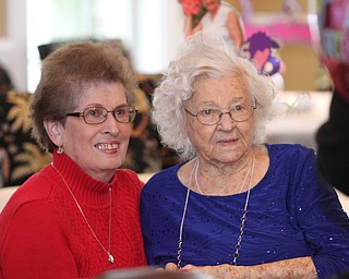 Mary Ann Beardsley(left) of Canfield poses for a photo with her adopted grandmother Sophie Antolik, as Sophie celebrates her 100th birthday at the Bradford Green Clubhouse at Westford Condos in Canfield on Saturday, Dec. 24, 2016...(Nikos Frazier | The Vindicator)..