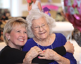 Melissa Trigg(left) of Raleigh, NC poses for a photo with her great-aunt Sophie Antolik, as Sophie celebrates her 100th birthday at the Bradford Green Clubhouse at Westford Condos in Canfield on Saturday, Dec. 24, 2016...(Nikos Frazier | The Vindicator)..