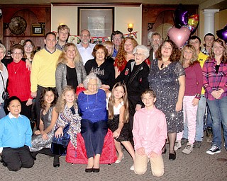 Family and Friends pose for a photo as Sophie Antolik(blue) celebrates her 100th birthday at the Bradford Green Clubhouse at Westford Condos in Canfield on Saturday, Dec. 24, 2016...(Nikos Frazier | The Vindicator)..