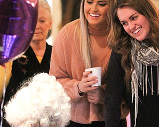 Emma(19) and Lily(17) Rothert congratulate their great-great-aunt Sophie Antolik as she celebrates her 100th birthday at the Bradford Green Clubhouse at Westford Condos in Canfield on Saturday, Dec. 24, 2016...(Nikos Frazier | The Vindicator)..