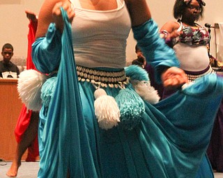 William D. Lewis the Vindicator Harambee dancer Myra Taylor, 17, of Youngstown performs during 12-26-16 Kwanza event at New Bethel Baptist Chiurch in Youngstown